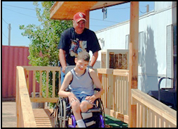 Bill and Catlin Ellis from Alamogordo, N.M., descend a wheelchair ramp build by the Elks of Alamogordo Lodge.