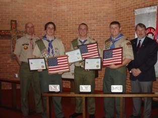 Exalted Ruler Greg Planting Giving eagle scouts certificate and flag from Elks lodge #133