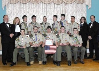 On May 1, 2008, the Taunton Lodge of Elks #150 hosted a reception for the most recent Eagle Scout Court of Honor.  In all 14 young men received Scouting's highest honor, the rank of Eagle Scout.  The lodge welcomed local Scout Leaders, Eagle Scouts and their families, and as part of the evenings festivities, Lee Davis, Exalted Ruler of the Taunton Lodge of Elks, presented each Eagle Scout with a special certificate along with an American Flag, in recognition of their hard work and dedication in becoming Eagle Scouts.   Those receiving the rank of Eagle Scout were: Derek U. Terrio Troop 20, Nigel E. Krofta Troop 25, Michael A. Archambault Troop 37, Michael J. Perry, Jr. Troop 40, Joseph P. Wieczorek Troop 40, Ethan A. Beise Troop 51, Daniel C. Dalton Troop 51, Matthew C. McCue Troop 51, Jay Patrick Thornton Troop 51, Michael A. Fiore Troop 61, Mark A. Ledbetter Troop 61, Eric R. Marsan Troop 61, Johnathan T. Lavelle Troop 79 and Michael P. DiBenedetto Troop 79.

Pictured Above (L-R) with 11 Eagle Scouts with their certificates and American Flags, are Taunton Lodge of Elks #150 Officers Matt Pittman Loyal Knight, Linda Downing Lecturing Knight, Sherry Rose Secretary and Lee Davis Exalted Ruler.