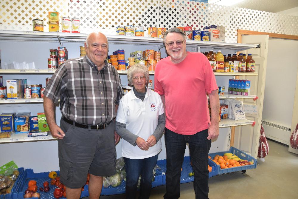 Ben, Marge and Peter at the Wilton Food Pantry getting ready to pack bags of food!