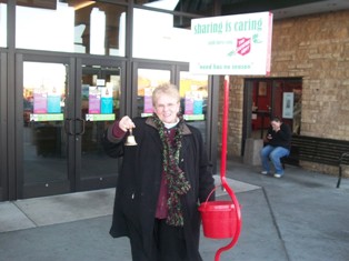 Exalted Ruler, Alice Wolf takes time from her volunteer shift to pose for a picture.  On Friday December 4th Elks volunteered for one hour shifts at the Salvation Army Kettle in front of Kennedy Mall.  