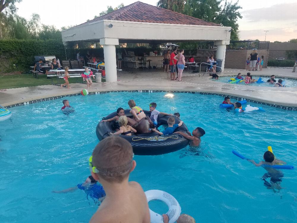 Kids enjoying the pool before the movie starts