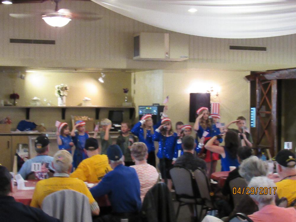 Some young Americans paying tribute to some WWII veterans at our Honor Flight Reunion luncheon.
