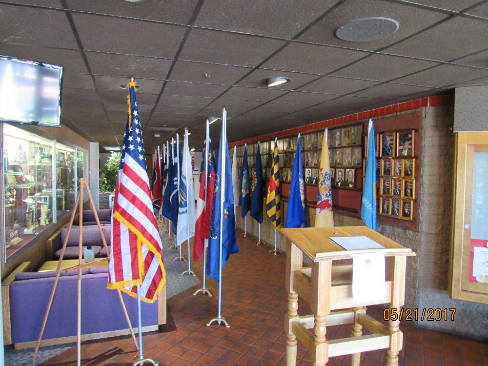 The front of our Lodge with the American Flag, all the state flags and the military flags set up.