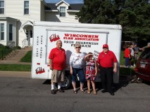 Elks Drug Awareness trailer that was in 2016 Memorial Day parade.  Pictured are George Myer (State President-Elect at time), Murial Myer, and guests from Rice Lake. 