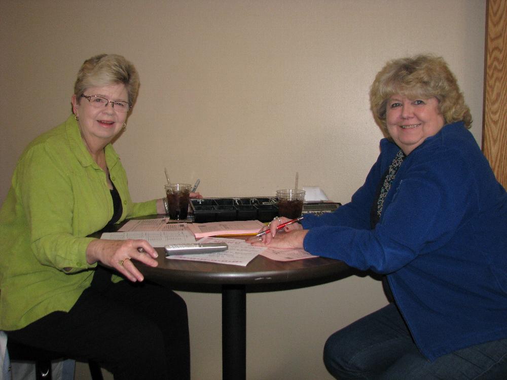 Elks Lady Sue Weimer and Lecturing Knight Diane Kramer take delivery orders.