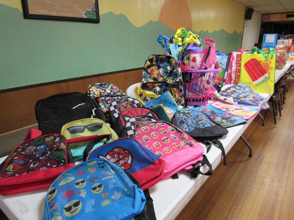 Some of the back packs and bags at the Lodge that will be filled with food for kids who need it during Spring Break - 2017-2018 Beacon Grant