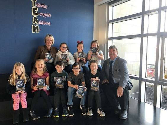 ER Steve Gregory and Suzanne Newswanger present dictionaries to students at the Owego Elementary School in support of the Elks Dictionary Project