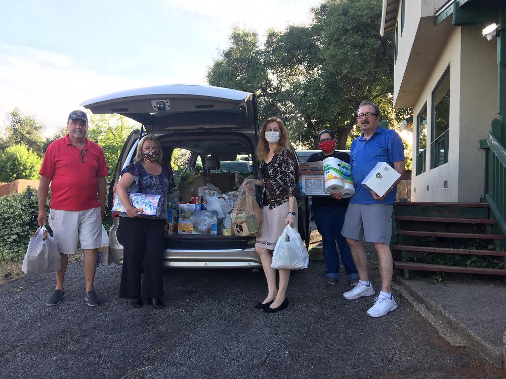 Treasure Mike Payne, Exalted Ruler Malinda Hutchison, Western Service Workers Association Emily Cunnison and Leading Knight Dave Wright during Food Drive 2020