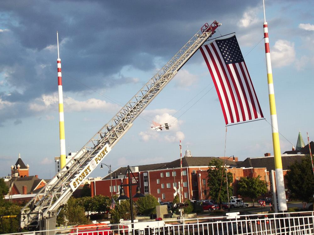 USA Flag Held High by Stoney Point Fire Dept...Downtown at Segra Stadium (Home of Fayetteville Woodpeckers Baseball)