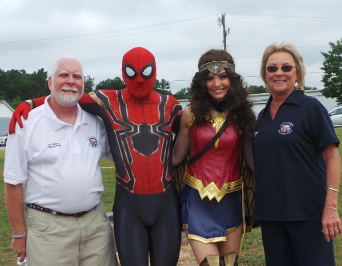 SC State President Fred Thompson and  1st Lady Diane Thompson with SpiderMan and Wonder Woman at the End of Summer Bash