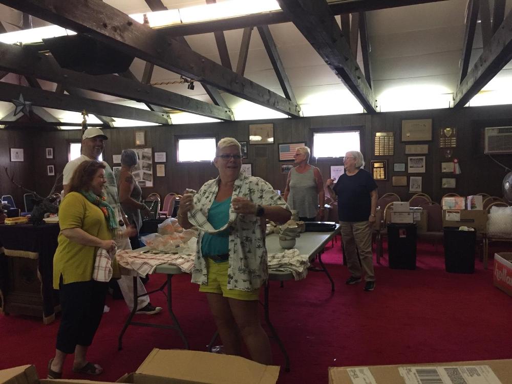 Great group of Hyannis Lodge #1549 Elks putting together the Veterans Household Helper totes.