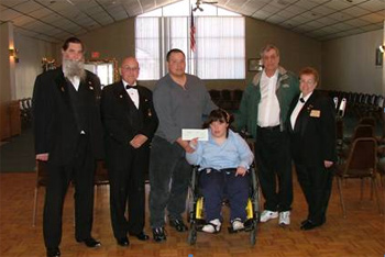Pictured from left to right::
Richard Billings Lodge Special Needs Chairman, Donald E. Cunningham State Trustee, Richard Castaldi Father, Recipient Jennifer Redman, 
Louis Provost Rhode Island State Elks President, Celeste M. Cunningham West Warwick Elks Lodge #1697 President.<BR><BR><b>Special Needs member presented a check for $8,200 to Jennifer for her 
special van lift chair.</b>
