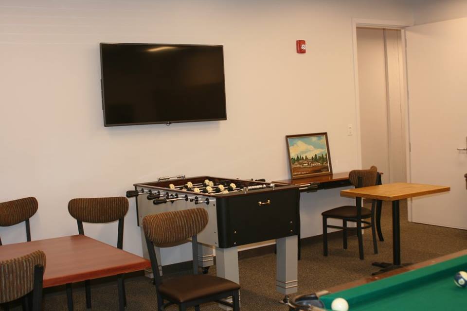Our gameroom with pool, foos ball and TV.