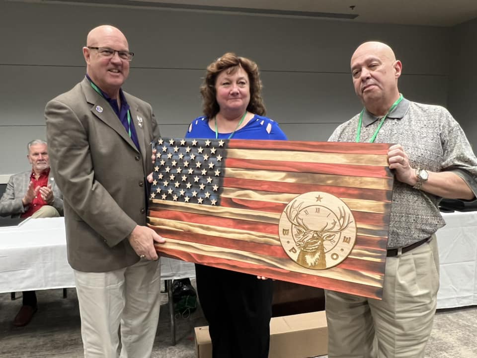 Calhoun Lodge Exalted Ruler Lynn Dee McDonald & Loyal Knight Carlos Ruiz present a gift on behalf of the Calhoun Lodge to Grand Exalted Ruler Bruce Hadley at the Georgia Elks Association Spring Quarterly meeting in Macon. The gift was custom made by Tactical Creations.
