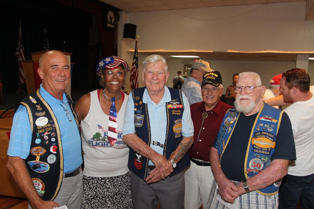 Marva X, Honor Flight Representative, with our own Harold Staggs and other WWII Veterans.