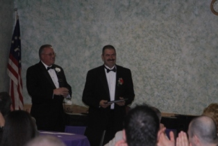 PER Wayne Pynckels presents the 2009 Officer of the Year Award to ER-Elect Angelo Golino, Jr.