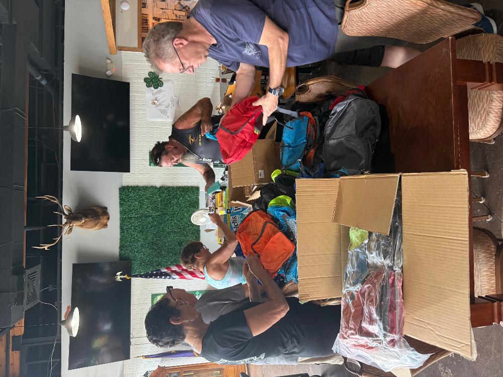 Pictured are now PER Gerald Droze and ER James Dykes on the right and some of our amazing members filling backpacks with toiletries for Veterans