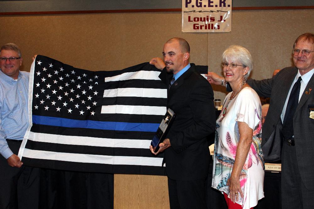 Police Officer of the year with Mother, Father and flag donation.