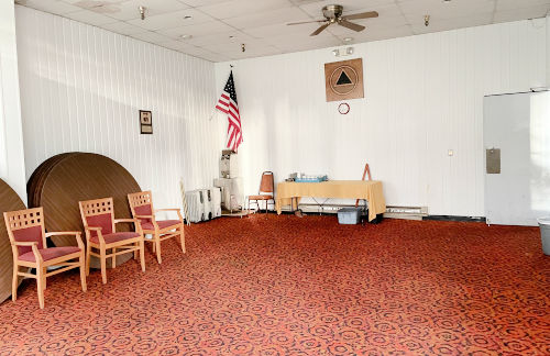 PER Conference Room. A rectangular conference room with red carpet.