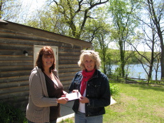 Check being presented to Pretty Lake Camp