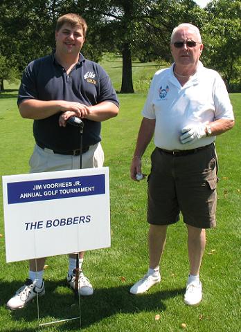 Rich Taylor and Fred Bixler stand behind "The Bobber" sponsor sign at the Elmira Elks Lodge #62 2nd annual James H. Voorhees Memorial Golf Tournament, to benefit Cerebral Palsy, the Major Project of the New York State Elks Association.  Many organizations and individuals sponsored the event to make it a huge success. This years Donation to Major Projects was $4000.00.