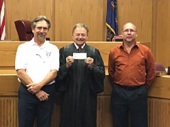 A $500.00 check was presented by Ray Buchowski and Greg Gargasz, Trustees, to the Lawrence County Drug Program. Accepting the check is Judge Dominick Motto.