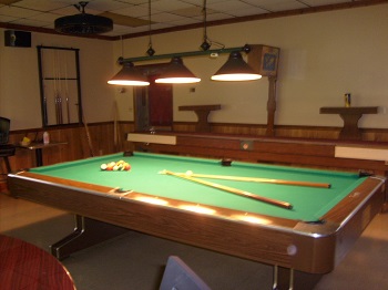 A very well kept, tournament sized, pool table in the Grill Room.