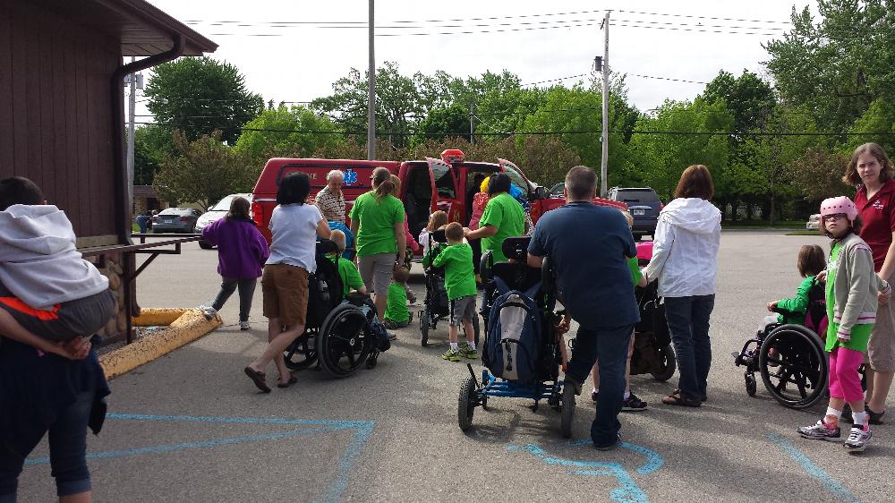 lining up for rides on the fire trucks