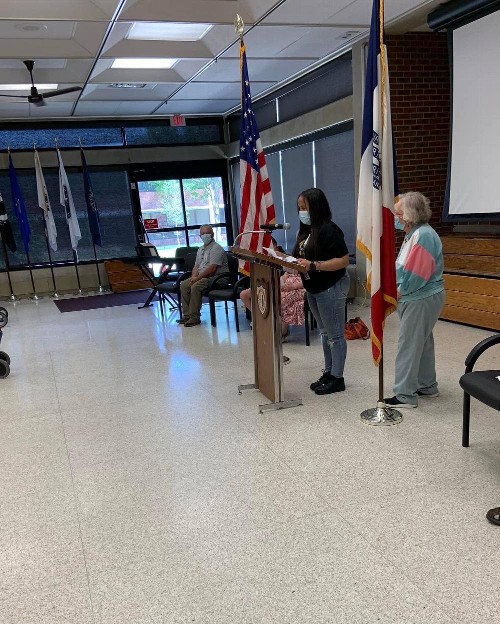 Student reading essay "What a Flag Means to Me"