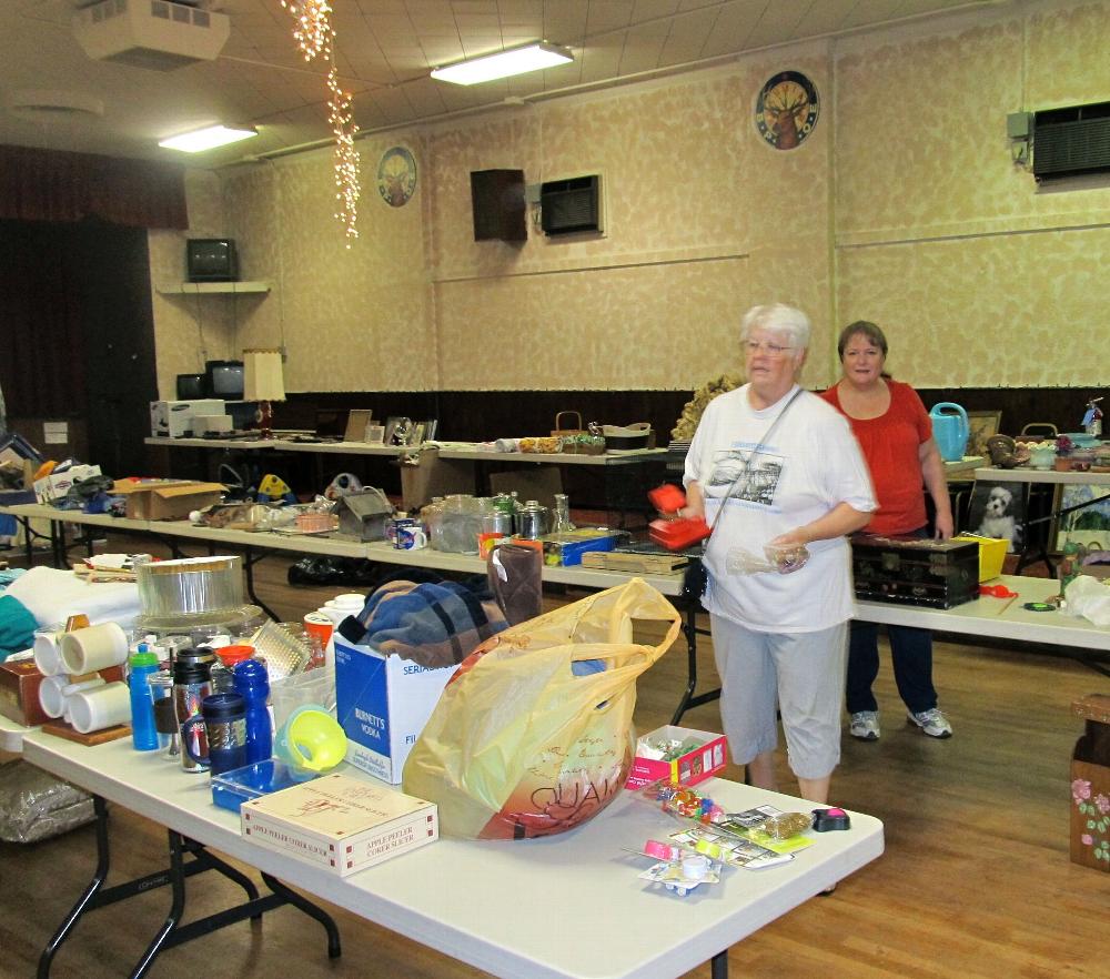 Cheryl Lumley & Joy Malone working on Elkette rummage sale