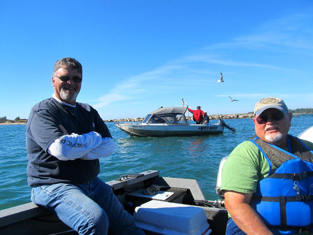 Joel Bouy & Tom Davis with Bob Davis's boat in the background.