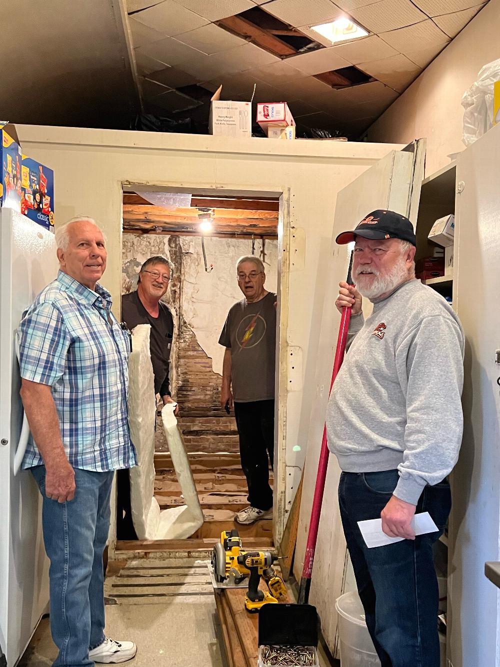 Tom, Gary, Randi, and Steve installing insulation