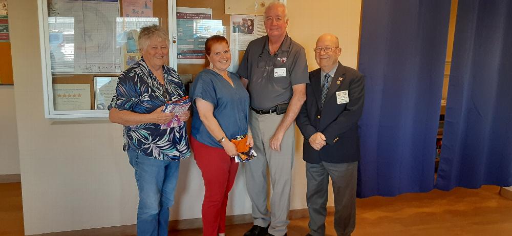 (Right) AZ State VP North S. Whitney with Tucson AZ Lodge #385 ER W. Burns, L. Castro from the AZ Steele Center (an AZ Major Project), accepting gifts for the kids and T. Morgan Vet Chair.   October 1, 2021