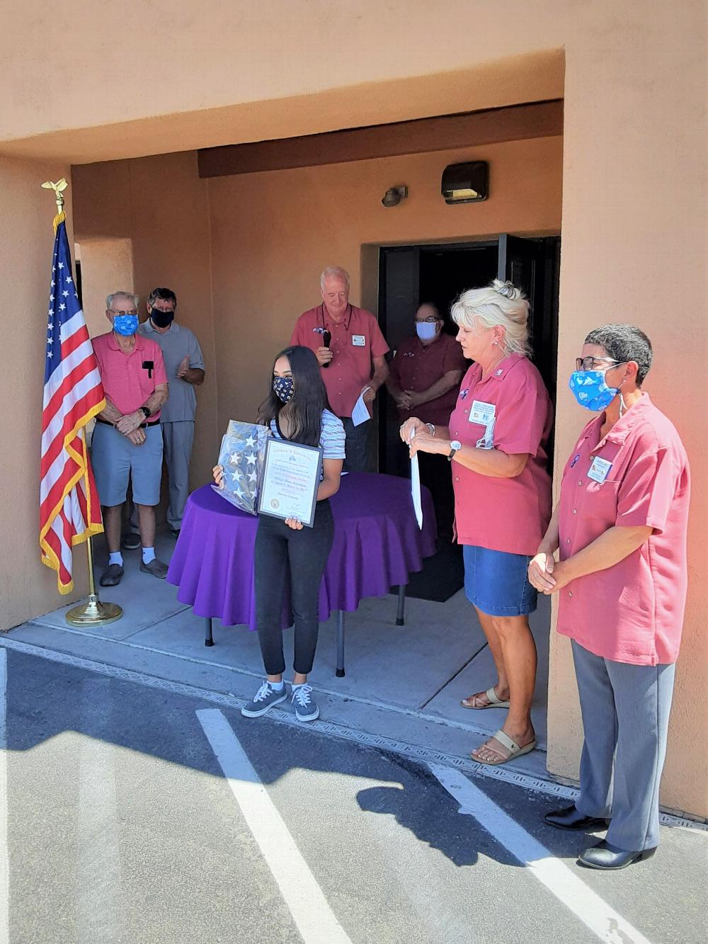 Tucson Elks Lodge @385  Americanism
Essay Contest winner for 6-2020.
Participants in this program write essays on patriotic themes selected by the
local Lodge Americanism Committee
and compete for National Recognition
and other awards. The Lodge Contest included schools within the jurisdiction of the Lodge.
Pictured with 2020 winner are Lodge officers.   