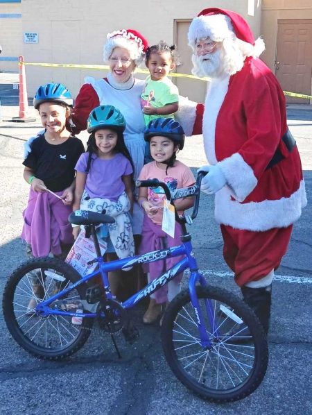 n December 6th, 2025, Tucson AZ Elks Lodge #385, in collaboration with Lugo Charities, held the 17th annual Bike in a Box event at Tucson AZ Elks Lodge #385. Volunteers dedicated their time to unload an impressive five hundred bicycles, which were donated to underprivileged children in the local Tucson area.
The atmosphere was magical as Santa, Mrs. Claus, and various superheroes greeted the thrilled children. Following registration, volunteers from the Tucson AZ Medical Center (TMC) ensured each child was custom-fitted with a safety helmet. Additionally, the Amphi High School basketball team lent a hand, assisting the children and helping them carry their new bicycles home to be assembled by their parents or guardians.
In total, five hundred delighted children received bicycles as Christmas gifts. On behalf of Tucson Elks Lodge #385 and Lugo Charities, we wish everyone a safe and healthy holiday season. Thanks to all the volunteers, this year's event was another grand success