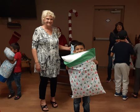 ER Susan Trecartin during Lodge #385 "Clothe A Child" and Carol Lugo helping, December 3, 2022.   Twenty five kids enjoyed lunch after the shopping spree and each received a bicycle for Christmas. 