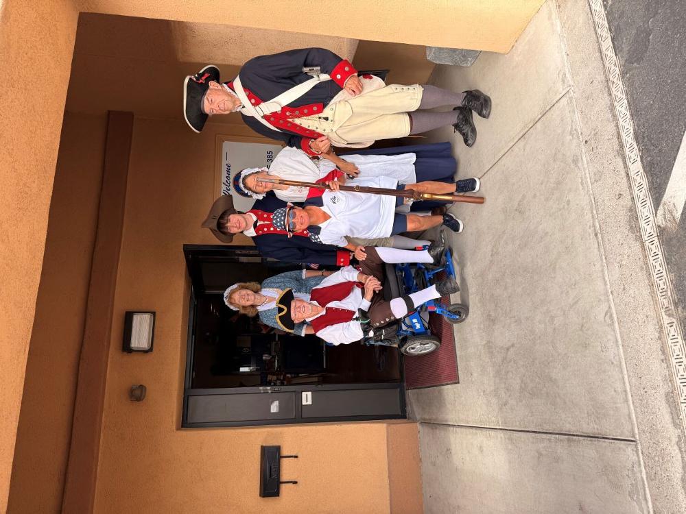 July 4th 2026 parade participants, L-R-PER Denny Scanlan, behind him member Ann Huber, PER  Matilda Lopez with cast of characters. 
