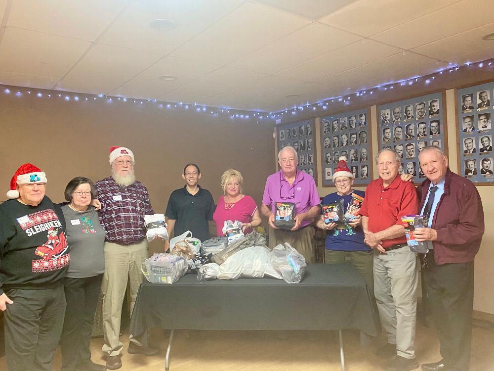 On December 4, 2025, the Tucson AZ Street Rod Association (TSRA) held its annual meeting at Tucson Lodge #385. As part of the event agenda, they collected various men's and women's clothing items, including 203 pairs of socks, 66 undergarments, and 20 new T-shirts, amounting to approximately $800. These items were graciously donated to the Tucson Az Elks Lodge #385 to support the Lodge's Veterans Programs.
Photo'd left to right:

Four TSRA members, Elk members M. Young, L. Ruiz, Trustee/PER W. Burns, TASRA member, PER J. Sanford, TSRA local President and Elk #385 member Gay Scheer. 