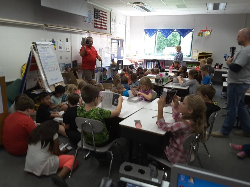 George Meyers presenting dictionaries to a third grade class.  Over 1300 dictionaries were given out to students in area schools.