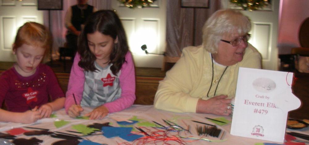 Lodge Secretary Shirley Gray had a table full of children making Christmas ornaments at the Festival of the Trees.  She and several other Elks and friends supervised 2 tables and helped over 200 children with the craft.