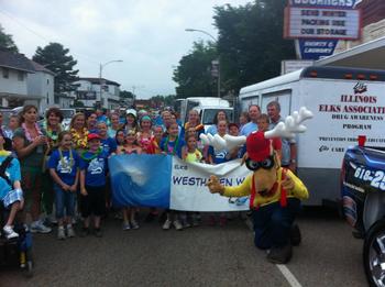 FUN AT SHRINER’S 2013 PARADE. Members, swim team and Elroy