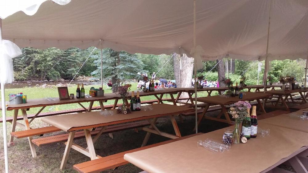 Seating for the reception, wedding in the background