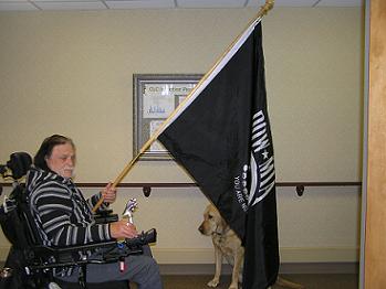 Lodge member and veteran Mr. John Beach carrying the POW/MIA flag in the Ten Flags ceremony that was performed for veterans while they ate their meal on Veterans Day 2011.