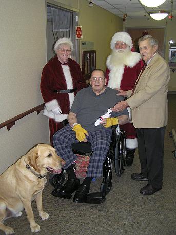 Mr. and Mrs. Claus (Dale and Levada) visiting the veterans at the Grand Island Veterans Hospital with State Veterans Chairman Dave Powers