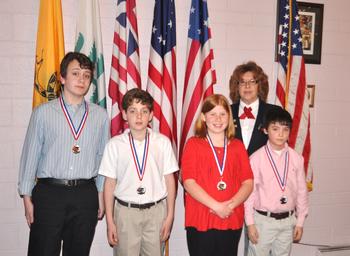 Hilda Byrd is shown with the 2012-2013 Americanism Essay Winners