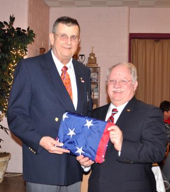 ER Jim McLain accepts a new flag from Danny Rice during our Americanism program