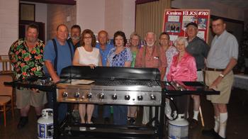 Members of Kinston Elks show the grill purchased for the NC State Veterans Home in Kinston, NC.
