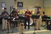 The famous "Jazz Happens" band plays at the Lodge's Mardi Gras First Friday event.  The room was decorated with art work and the New Orleans favor of the times. John, Carrie, and Kim.  Great job!