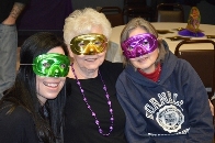 Three Mardi Gras women enjoying the evening. 